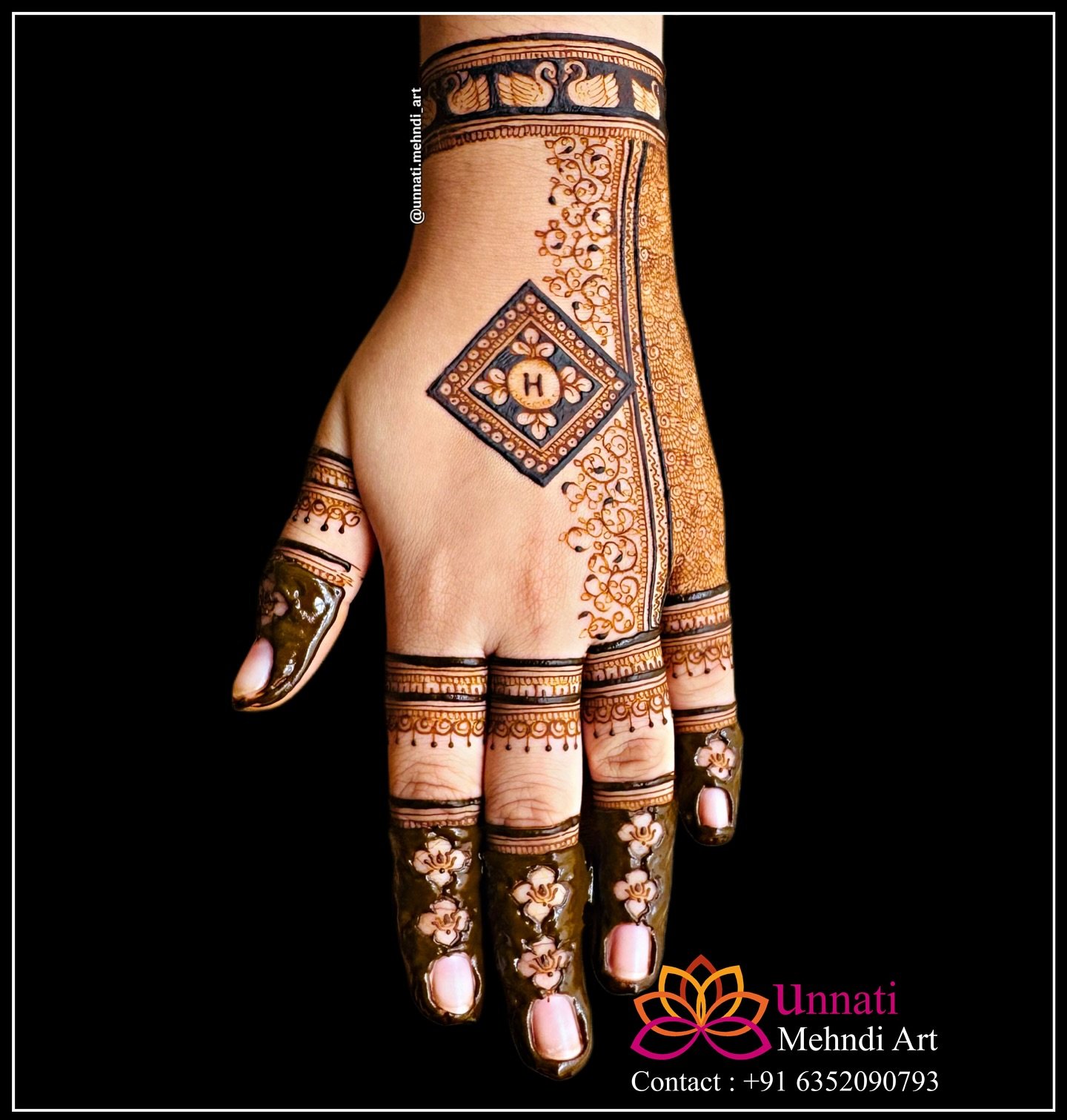 Bridal mehndi artist creating intricate henna design